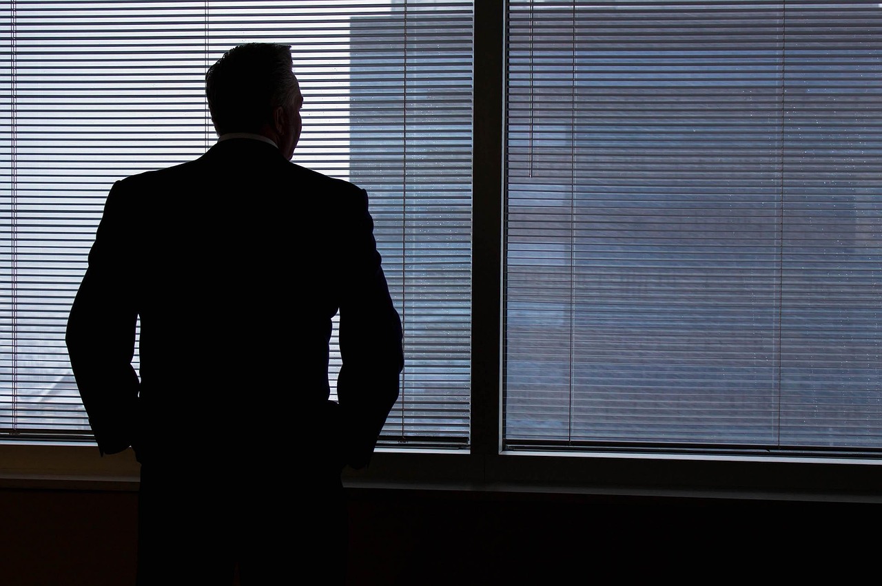 Businessman, silhouette, windows — How IP TV Works to Deliver Live Channels and On-Demand Entertainment